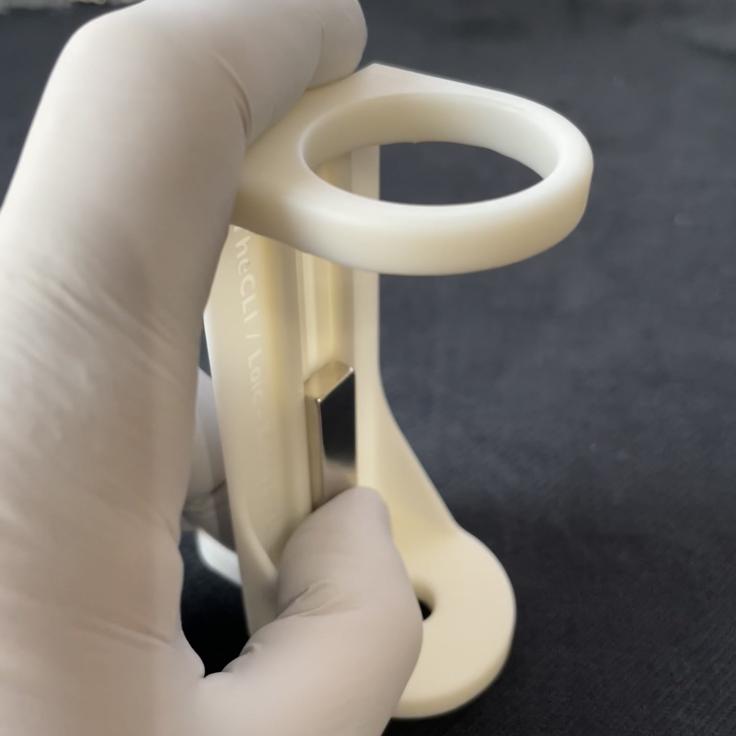 The magnets can be shifted up and down to adjust to the fill level of the tube